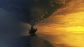 Corpus Christi Urges Prep as a powerful tornado touches down under a dramatic sky with dark storm clouds and a glowing sunset horizon.