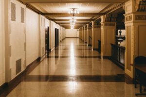 Elegant hallway with chandeliers and ornate columns, possibly inside a church or historic building — Gospel Giant Jimmy Swaggart tribute.