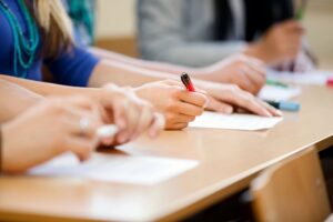 Students writing in a classroom during school activities; London ISD Opens New Primary School to support early education growth.