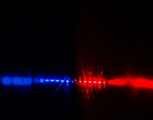 Red and blue police lights glowing in darkness, symbolizing law enforcement as Corpus Christi Police Seek public help in case.