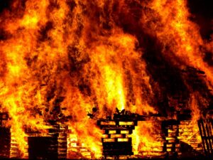 Massive fire engulfs wooden structure in flames at night — teen hero rescue fire, Corpus Christi burning home rescue.
