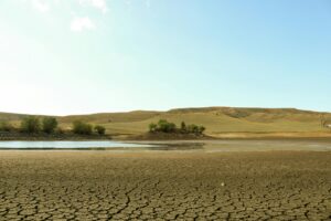 Corpus Christi water crisis shows cracked dry land and shrinking reservoir levels as severe drought strains water supply.