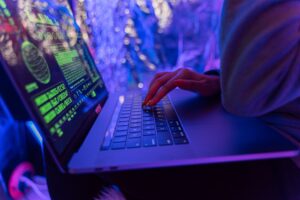 Former fire captain case highlights cybercrime investigation with laptop displaying digital forensic and online security data.