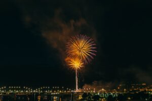 Golden fireworks light the night sky over the waterfront during the Coastal Bend Fourth of July celebration.