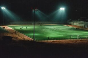 Night-lit football stadium representing Texas Longhorns jersey patch sponsorship potential in college football.