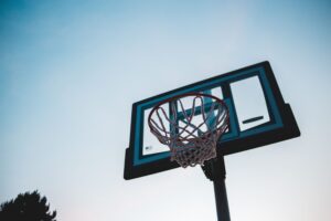 Basketball hoop against a blue sky, illustrating the San Antonio Spurs 2026-27 schedule and broadcast coverage for NBA fans.